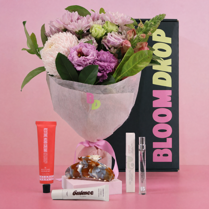 Beauty and flower gift hamper with fresh flowers, perfume, lip balm, hand cream and Kitty Paloma claw clip for Sydney gift delivery