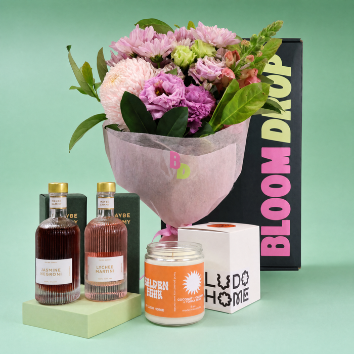 New home gift hamper Sydney with flowers, Maybe Sammy cocktails and Ludo Home candle