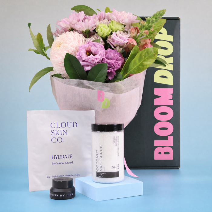 Self care gift hamper Sydney with flowers, body scrub, collagen face mask and lip balm