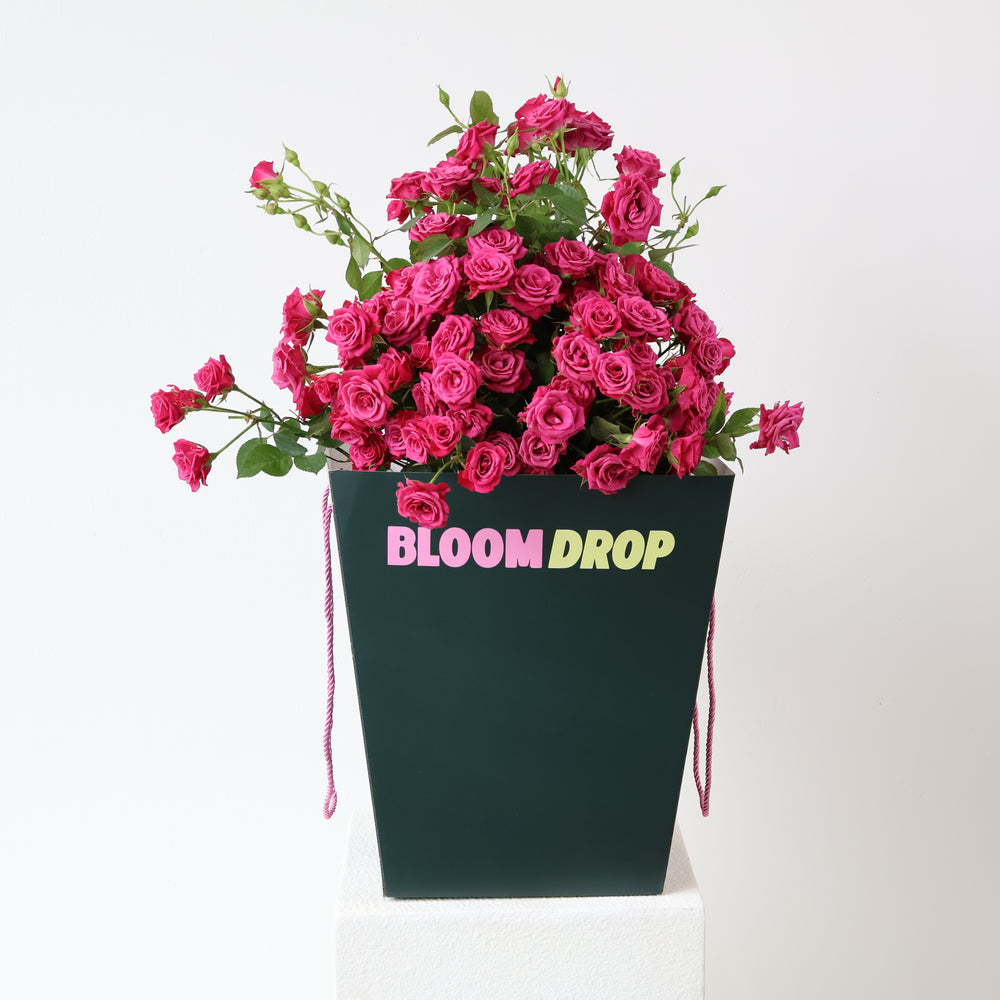 En masse spray roses in the signature Bloom Drop Tote Boxy Bag for Sydney flower delivery