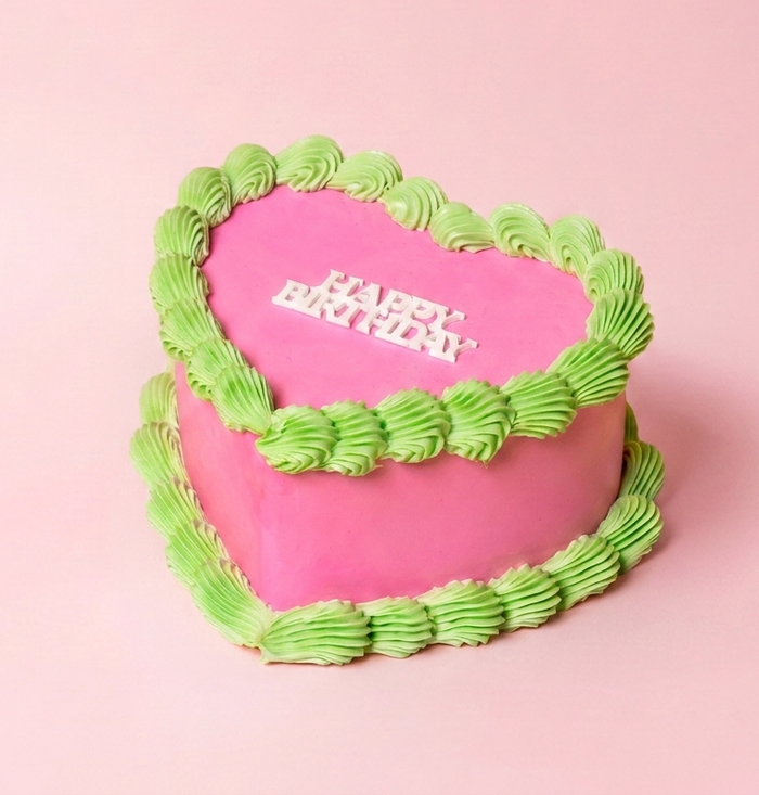 Pink Tangy Raspberry Cake featuring white chocolate mud cake with vanilla-bean buttercream and a layer of tangy raspberry jam for Sydney cake delivery by Bloom Drop